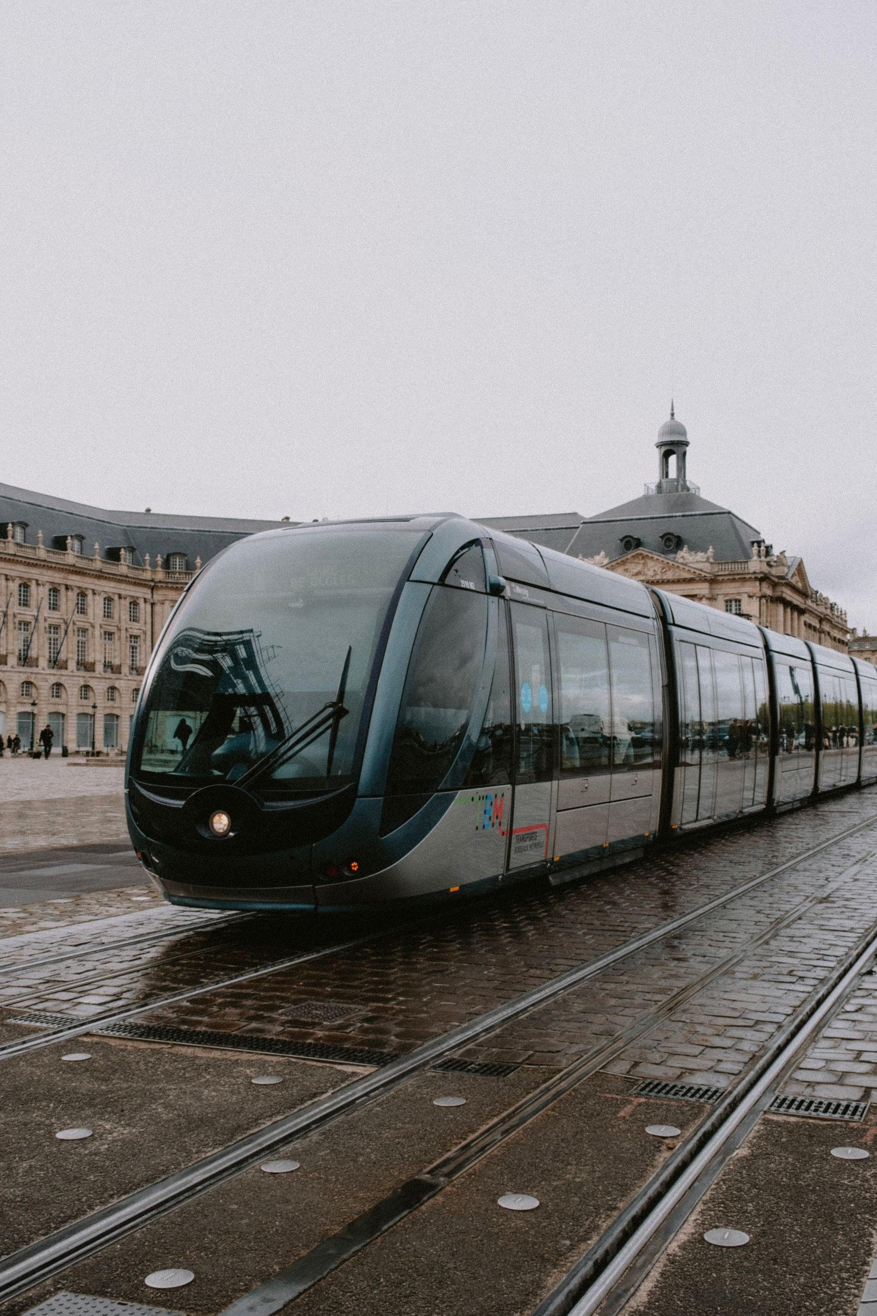 Tram tracks on a wet Bordeaux street