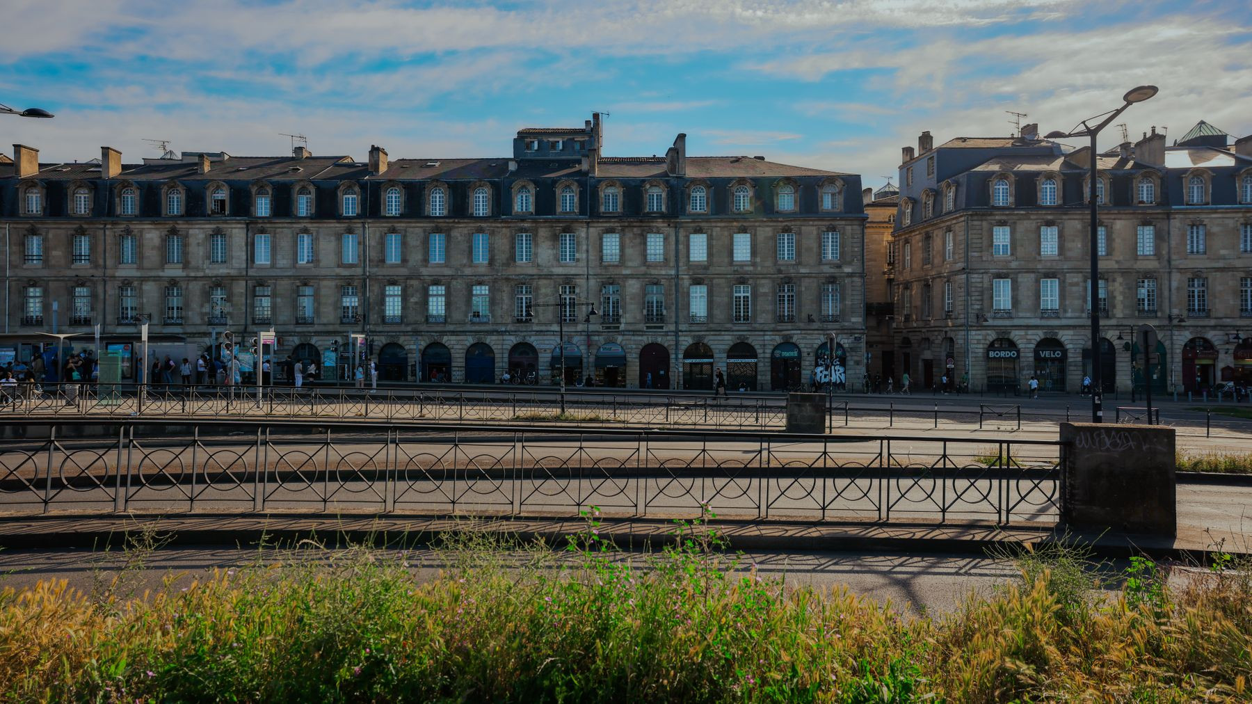 Classical Bordeaux facades under a clear sky