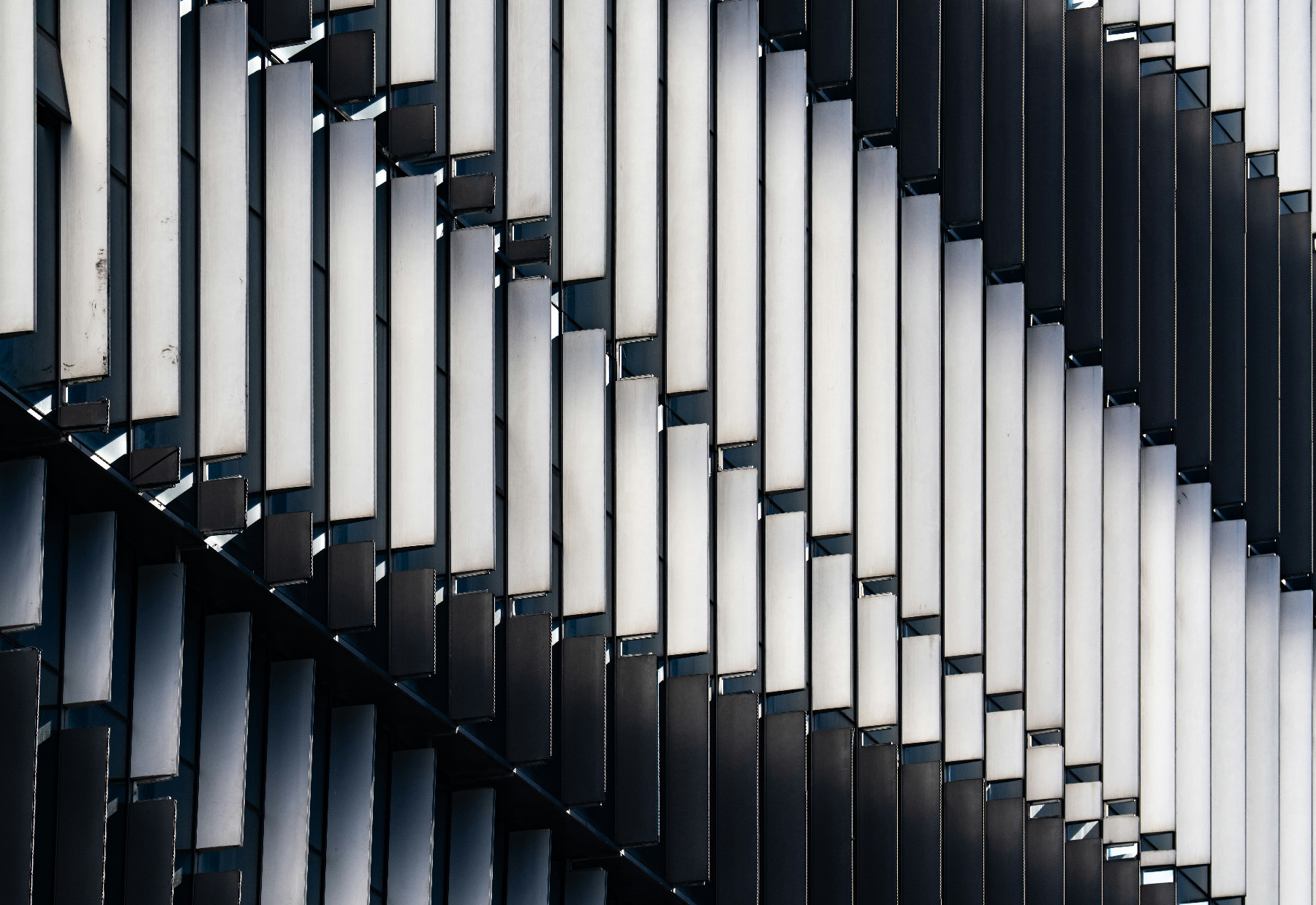 Layered metal fins on a contemporary office facade