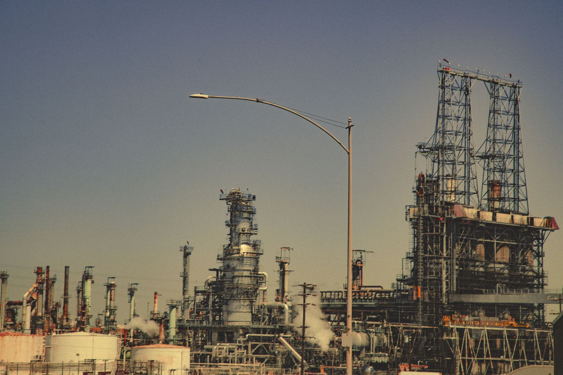 An industrial plant with pipes and cooling towers