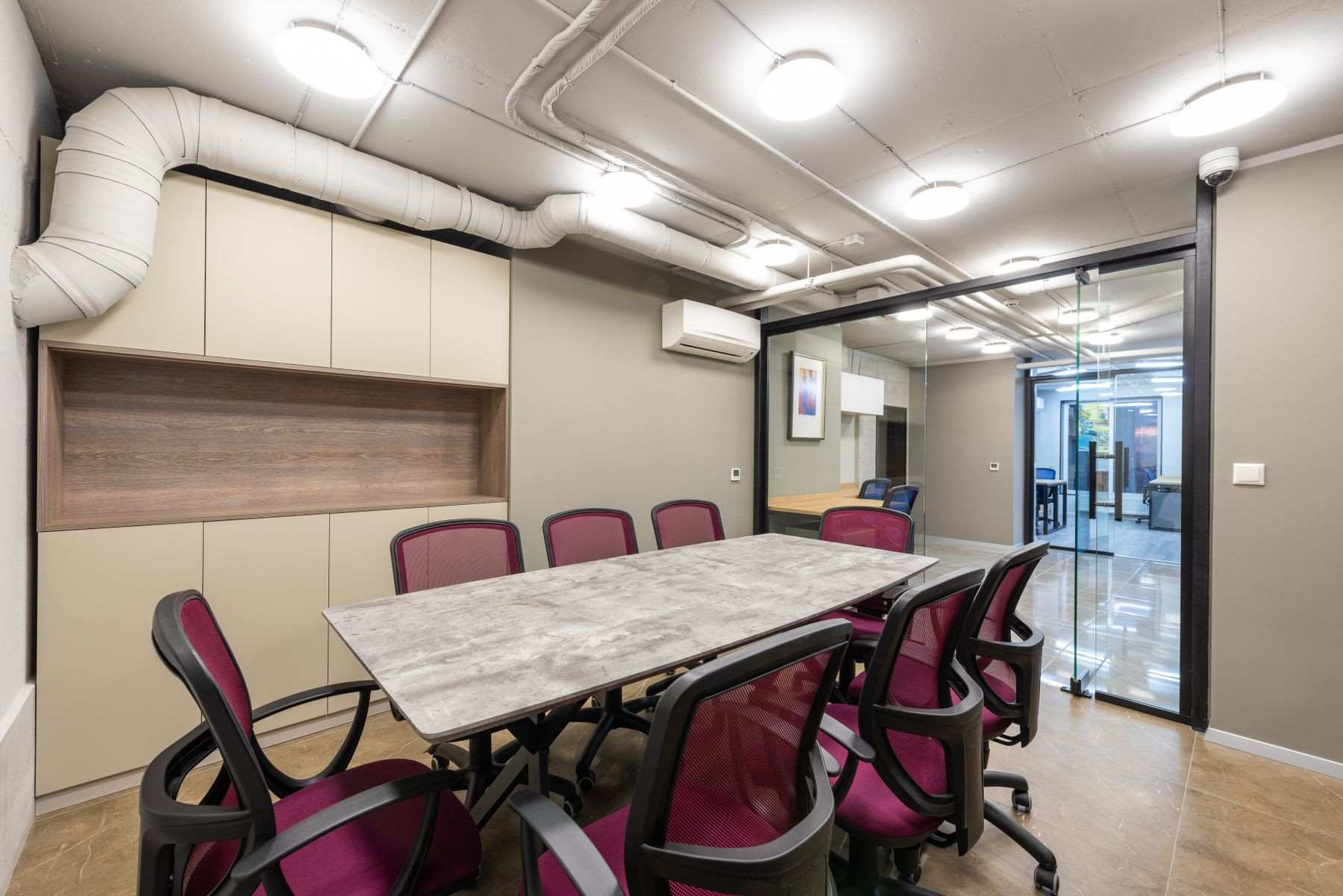 Boardroom with glass walls in a modern workspace